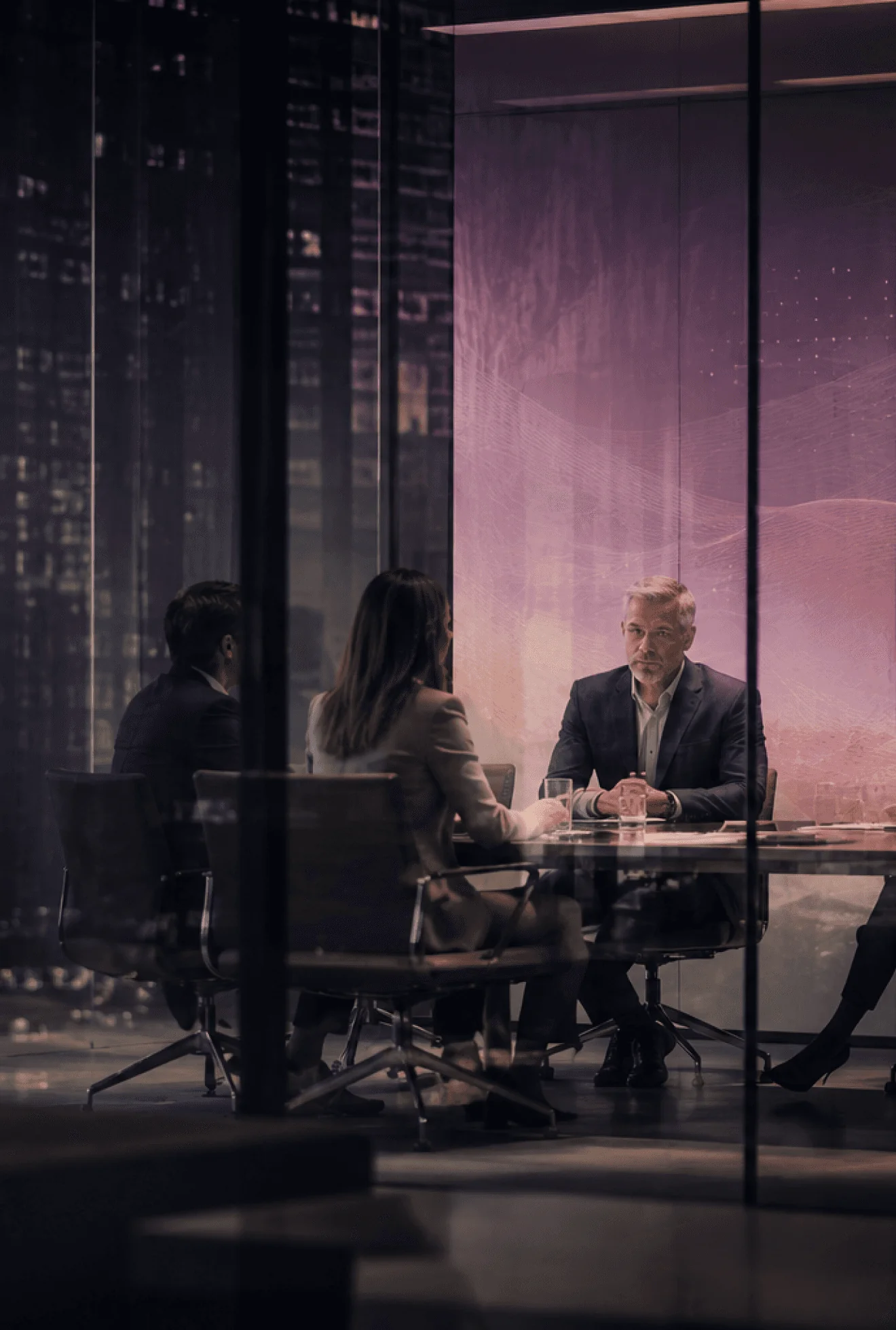 Managers in conversation in a meeting room